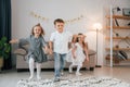 Having fun at birthday party. Group of children is together at home at daytime Royalty Free Stock Photo