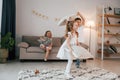 Having fun at birthday party. Group of children is together at home at daytime Royalty Free Stock Photo