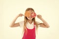 Having fun with candies. Happy child with lollipops. Little kid smile with candies on sticks isolated on white. Girl