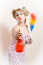 Having fun gorgeous beautiful funny young blond pinup woman splashing water, removing dust expressing kiss & looking at camera Royalty Free Stock Photo