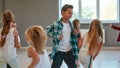 Having fun. Group of positive children learning a modern dance in the dance studio. Choreography concept Royalty Free Stock Photo