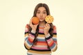 having fun. kid choose food. funny teen girl with orange lollipop. vitamin and dieting. Royalty Free Stock Photo