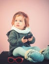 Having fun. kid listen music with headset and mp3 on phone. winter kid fashion. small happy girl. little girl child Royalty Free Stock Photo
