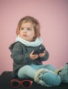 Having fun. kid listen music with headset and mp3 on phone. winter kid fashion. small happy girl. little girl child Royalty Free Stock Photo