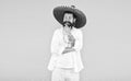 having fun on mexican party. mature bearded hipster in sombrero. summer holiday and vacation. happy mexican man wearing Royalty Free Stock Photo