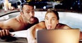 Having fun our little holiday. an affectionate mature couple taking selfies on their tablet while relaxing in a hot tub. Royalty Free Stock Photo