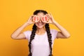 Indian lady covering eyes with halves of grapefruit Royalty Free Stock Photo