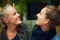 Having a fun time. two young women having a good time at an outdoor festival.