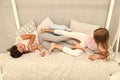 Having fun together. fun before sleep. best friends. sisters playing in bed. sweet dreams. pajama party in bedroom Royalty Free Stock Photo