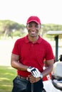 Having a great day out. Portrait of a happy young man standing on a golf course. Royalty Free Stock Photo