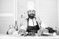 Having lunch. Bearded man cook in kitchen, culinary. Vegetarian. Mature chef with beard. Dieting and organic food Royalty Free Stock Photo