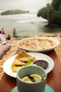 Holiday Breakfast at a Beachside Cafe with Seaview Background