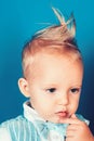 Having a modern haircut. Boy child with stylish blond hair. Small child with messy top haircut. Small boy with stylish Royalty Free Stock Photo