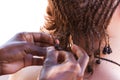 Having my cornrows done locally in Malawi