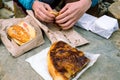 Having traditional Slovenian breakfast outdoor at natural rock table Royalty Free Stock Photo