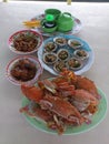 Having Vietnamese grilled mussels and crabs for lunch