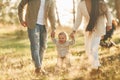 Having a walk. Happy family of father, mother and little daughter is in the forest Royalty Free Stock Photo