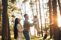 Having a walk. Happy family of father, mother and little daughter is in the forest Royalty Free Stock Photo