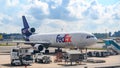 Loading of Fedex Express  - McDonnell Douglas - The World on Time -  Services at Singapore Airport. International cargo. Royalty Free Stock Photo