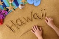 Hawaii beach word writing sand