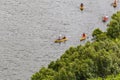 Hawaii, USA - September 22, 2018: Tourists kayaking on a river on the island of Kauai. Lush tropical forest on the river bank. Royalty Free Stock Photo