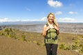 The Hawaii volcano tourist woman at Halemaumau crater in Kilauea caldera in Hawaii Volcanoes National Park Royalty Free Stock Photo