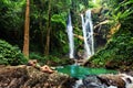 Hawaii woman tourist excited by waterfall