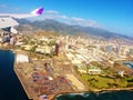 Hawaiian airlines wing of plane above honolulu