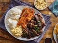 Hawaiian bbq plate with mix of chicken katsu, korean kalbi beef short ribs, rice, and macaroni salad Royalty Free Stock Photo