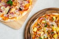 Hawaiian Chicken BBQ Italian Pizza and Bacon,Garlic and Chilli Italian Pizza on wood dish Royalty Free Stock Photo