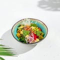 Hawaiian cuisine - Poke bowl with salmon, avocado, edamame and vegetables. Pokebowl in ceramic dish on white background with Royalty Free Stock Photo