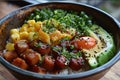 Hawaiian cuisine, poke bowl with salmon, avocado, mango, cucumber, sesame seeds Royalty Free Stock Photo