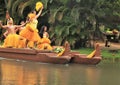 Oahu, Hawaii - 4/26/2018 - Hawaiian dancers performing while riding a canoe float at the Polynesian Cultural Center in Hawaii