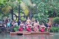 Oahu, Hawaii - 4/26/2018 - Hawaiian dancers performing while riding a canoe float at the Polynesian Cultural Center in Hawaii