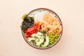 Hawaiian diet dish with seafood. A bowl with shrimp, rice, avocado, pepper