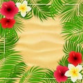 Hawaiian flowers and palm leaves on sandy background