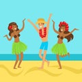 Hawaiian girls and happy man dancing on on a tropical beach Royalty Free Stock Photo