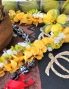 Hawaiian lei necklaces made with flowers and kukui nuts