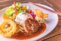 Hawaiian Loco Moko rice plate with an hamburger on a plate with chopsticks in a Japanese restaurant. Royalty Free Stock Photo