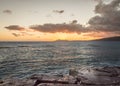 Hawaiian outrigger canoes at sunset Royalty Free Stock Photo