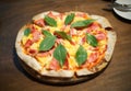 Hawaiian pizza on wood table : closeup