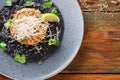 Hawaiian poke on black sesame flat cake. Modern restaurant food background