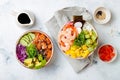 Hawaiian salmon and shrimp poke bowls with seaweed, avocado, mango, pickled ginger, sesame seeds. Royalty Free Stock Photo