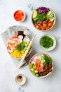 Hawaiian salmon, tuna and shrimp poke bowls with seaweed, avocado, mango, pickled ginger, sesame seeds. Royalty Free Stock Photo