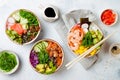 Hawaiian salmon, tuna and shrimp poke bowls with seaweed, avocado, mango, pickled ginger, sesame seeds. Royalty Free Stock Photo