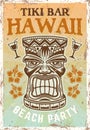 Hawaiian tiki head colored vintage poster with traditional tribal wooden mask , sample text and grunge textures on Royalty Free Stock Photo