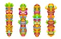 Hawaiian tribal totems with tiki masks on poles Royalty Free Stock Photo