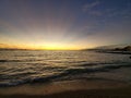 Hawaiian tropical sunset in Waikiki with golden rays Royalty Free Stock Photo