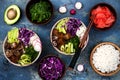 Hawaiian tuna poke bowl with seaweed, avocado, red cabbage, radishes and black sesame seeds.