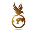 Hawk over the globe. Gold falcon over the planet earth. Logo